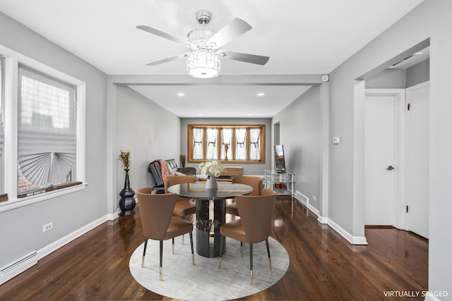 dining space with a baseboard radiator, recessed lighting, a ceiling fan, wood finished floors, and baseboards