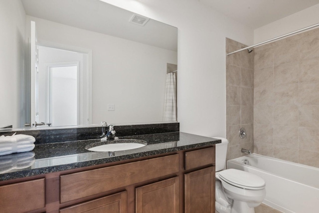 full bathroom featuring  shower combination, visible vents, vanity, and toilet