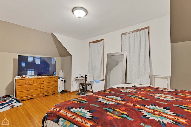 bedroom with wood finished floors