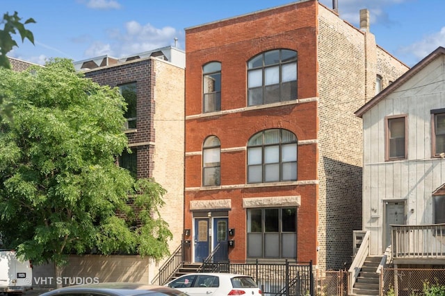 view of front of house featuring brick siding