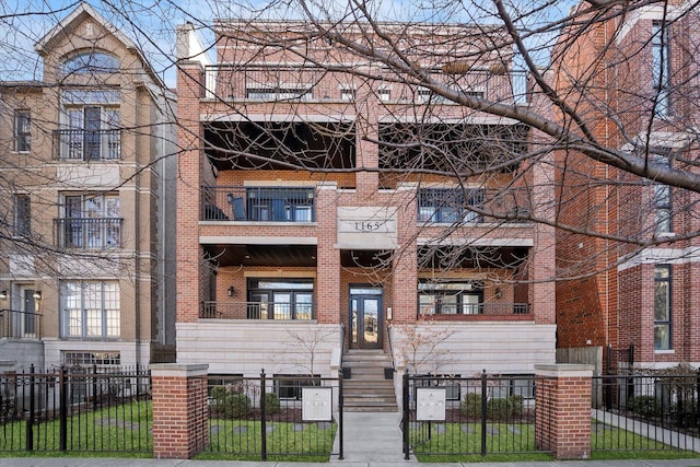 view of building exterior featuring a fenced front yard