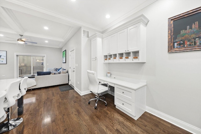 office area with dark wood-type flooring, built in desk, visible vents, and baseboards