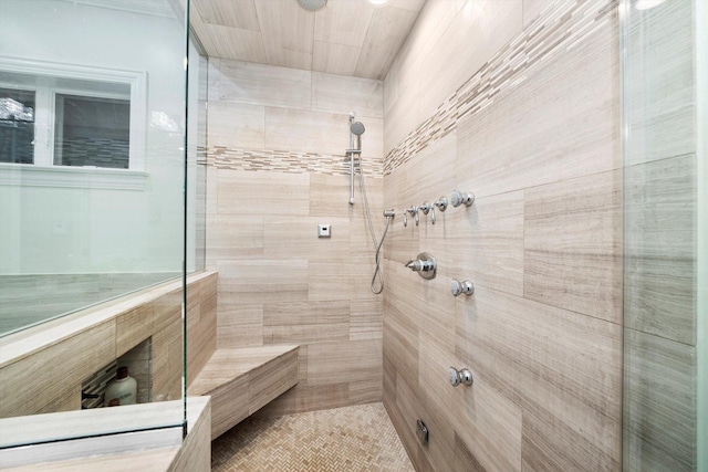 bathroom with a tile shower