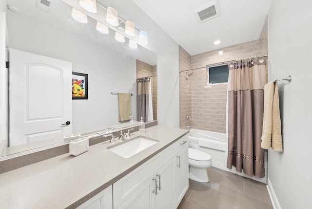 full bath featuring toilet, vanity, tile patterned flooring, and visible vents