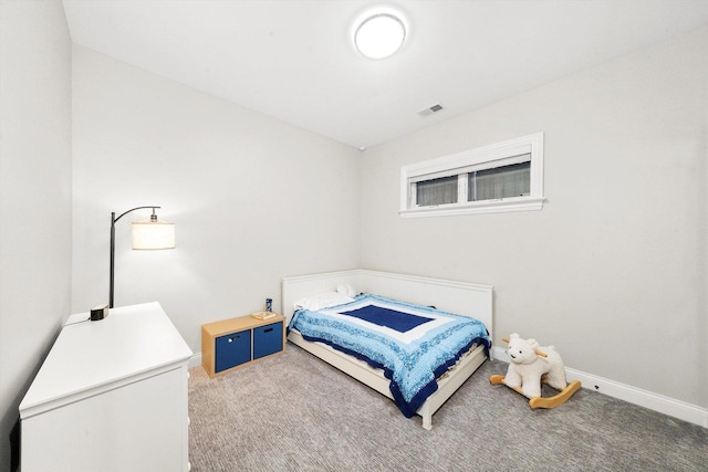 bedroom with carpet flooring, visible vents, and baseboards