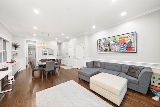 living room featuring wainscoting, dark wood finished floors, and recessed lighting