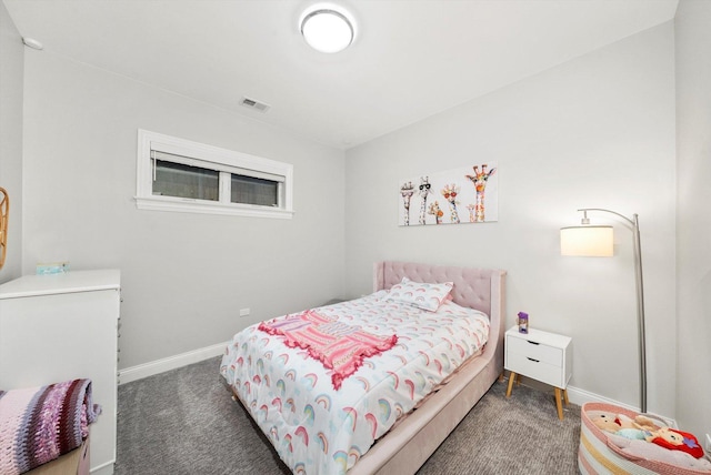 carpeted bedroom with visible vents and baseboards