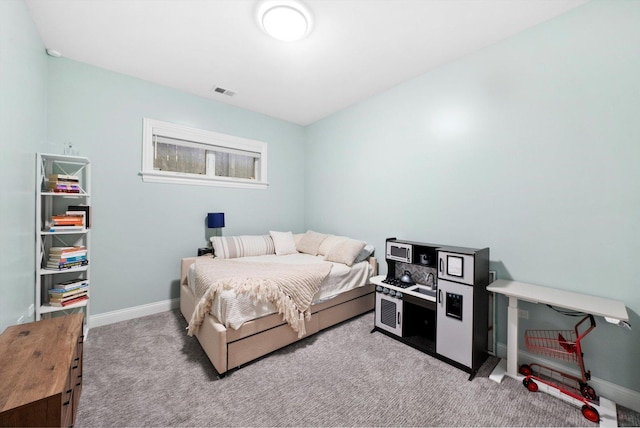 bedroom with baseboards, visible vents, and carpet flooring