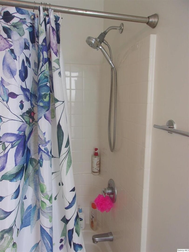 full bathroom featuring shower / bath combination with curtain