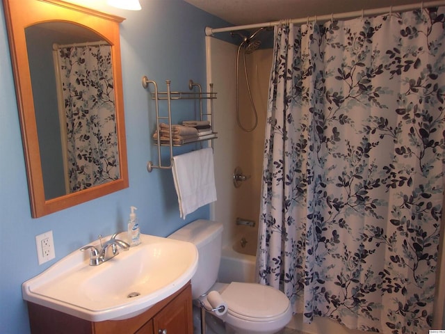 full bathroom featuring toilet, shower / tub combo with curtain, and vanity