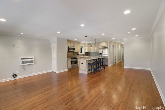 unfurnished living room featuring recessed lighting, baseboards, dark wood finished floors, and ornamental molding