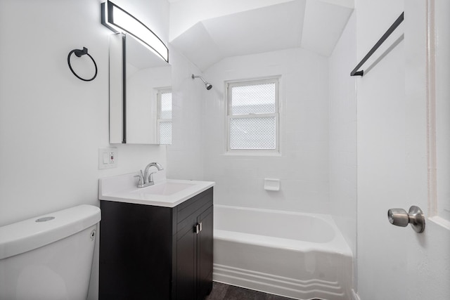 full bathroom featuring washtub / shower combination, vanity, and toilet