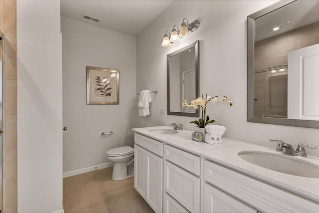 full bathroom featuring visible vents, a sink, toilet, and tiled shower