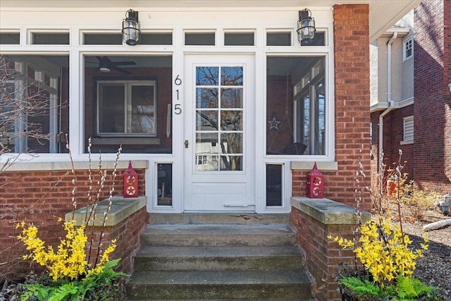 property entrance with brick siding