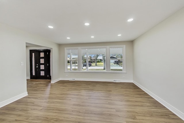 interior space featuring visible vents, recessed lighting, wood finished floors, and baseboards