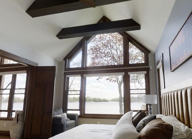 bedroom with high vaulted ceiling and beamed ceiling