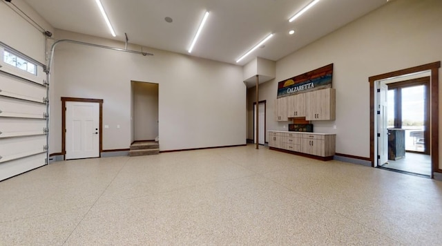 garage featuring baseboards