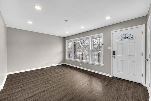 foyer entrance featuring visible vents, baseboards, dark wood finished floors, and recessed lighting