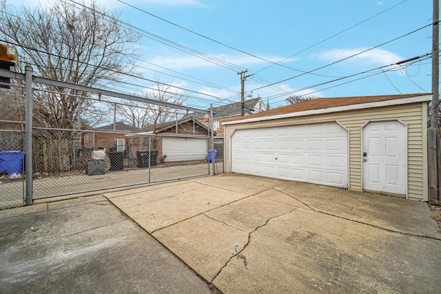 detached garage featuring fence