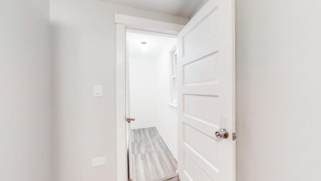 hall featuring wood finished floors