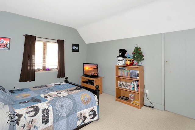 carpeted bedroom featuring lofted ceiling