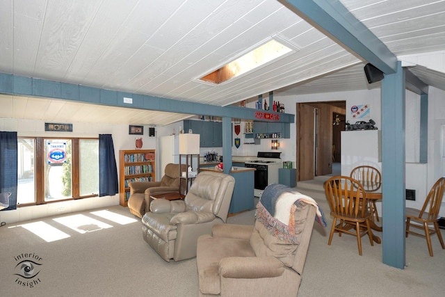 living area with vaulted ceiling and light colored carpet