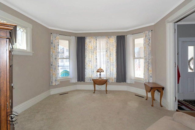 sitting room with carpet, visible vents, and baseboards