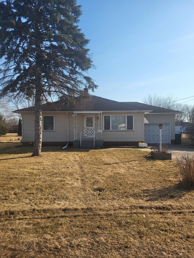 single story home with a garage and a front yard