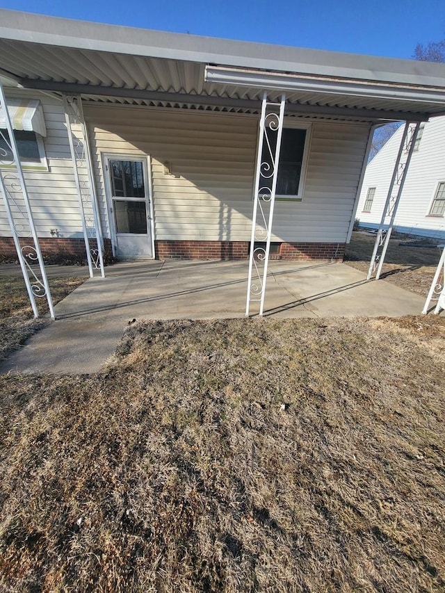 rear view of property featuring crawl space