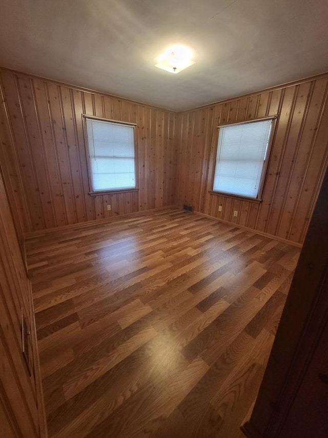 empty room with wood finished floors