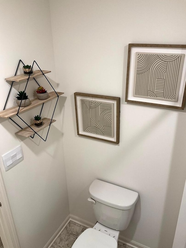 1315 Stonecrop Ln, Joliet, IL 60431 - bathroom featuring baseboards, toilet, and marble look tile flooring