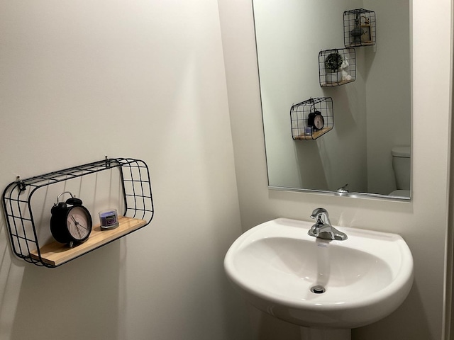 1315 Stonecrop Ln, Joliet, IL 60431 - half bath featuring a sink and toilet