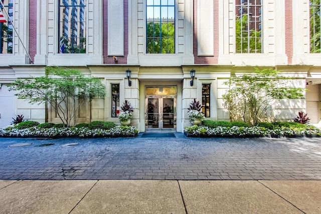 entrance to property with french doors and brick siding