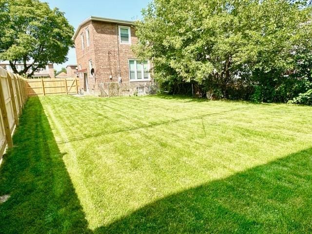 view of yard with a fenced backyard