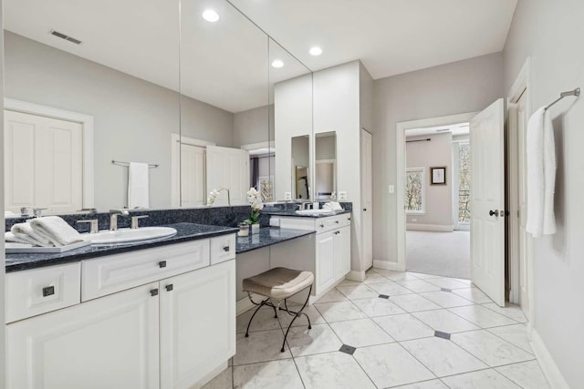 bathroom featuring recessed lighting, visible vents, baseboards, and vanity