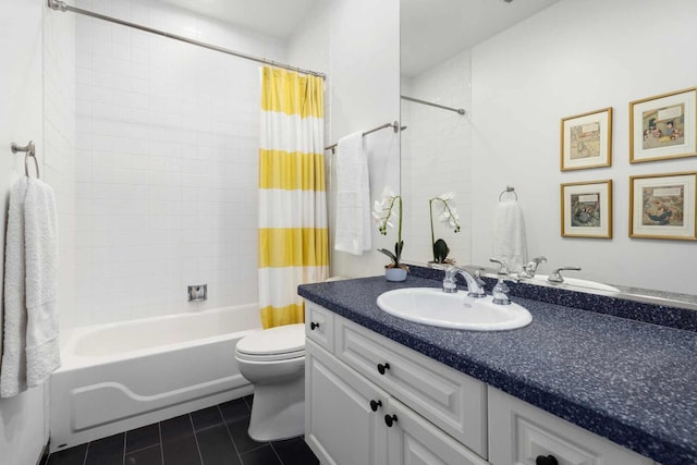 full bath featuring toilet, shower / tub combo, vanity, and tile patterned floors