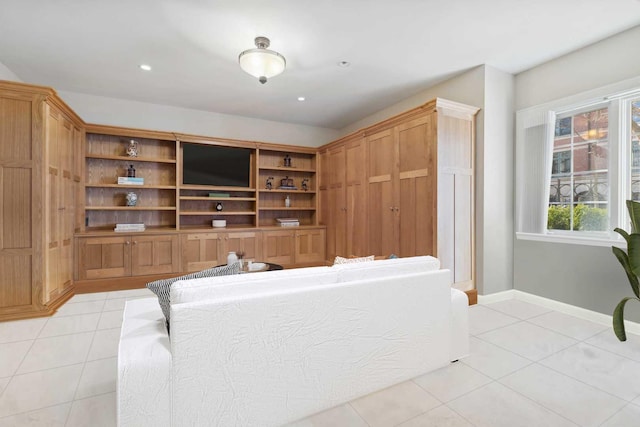 living area featuring recessed lighting, baseboards, and light tile patterned floors