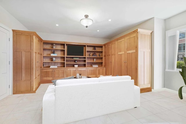 living room featuring recessed lighting, baseboards, and light tile patterned floors