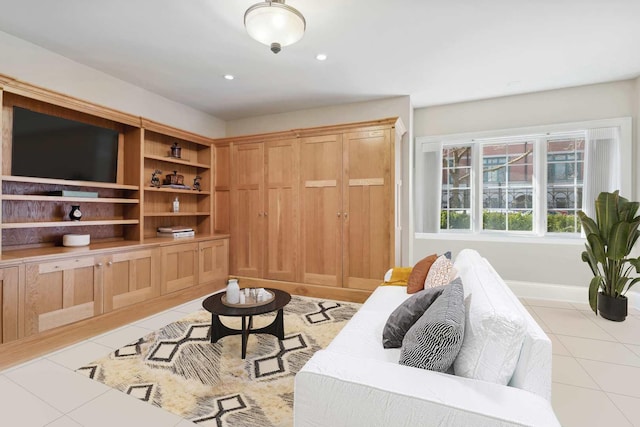 living room with light tile patterned floors and recessed lighting