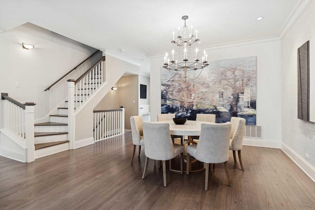 dining space featuring baseboards, stairway, ornamental molding, wood finished floors, and a notable chandelier