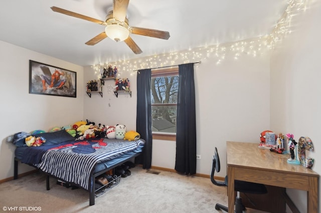 carpeted bedroom with visible vents, baseboards, and ceiling fan