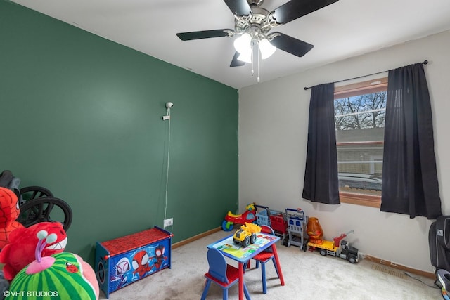 game room featuring carpet floors, baseboards, and a ceiling fan