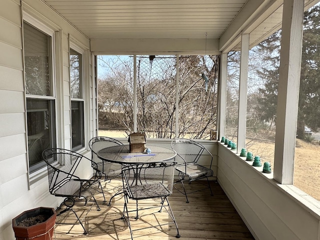 sunroom / solarium featuring wood ceiling