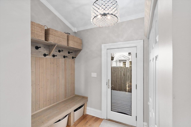 mudroom with ornamental molding, baseboards, an inviting chandelier, and wood finished floors