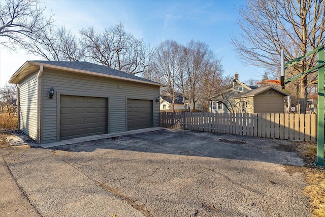 detached garage with fence