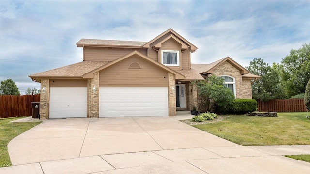 traditional-style house with brick siding, a front yard, and fence