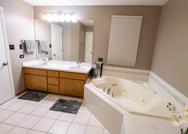 laundry room featuring washer and clothes dryer, cabinet space, dark wood-type flooring, a sink, and baseboards