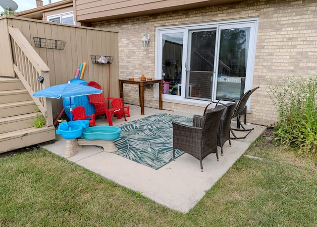 view of patio / terrace featuring stairs and an outdoor living space