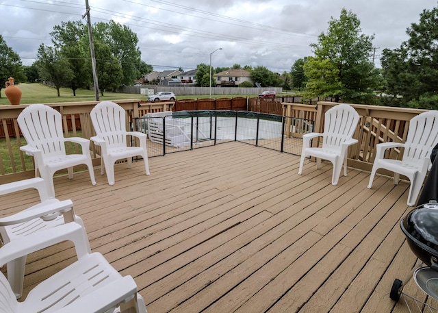 wooden deck featuring fence