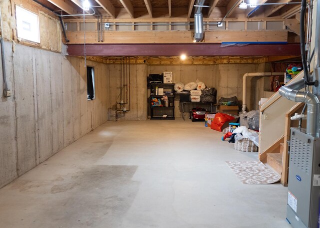 unfinished below grade area with water heater and stairway